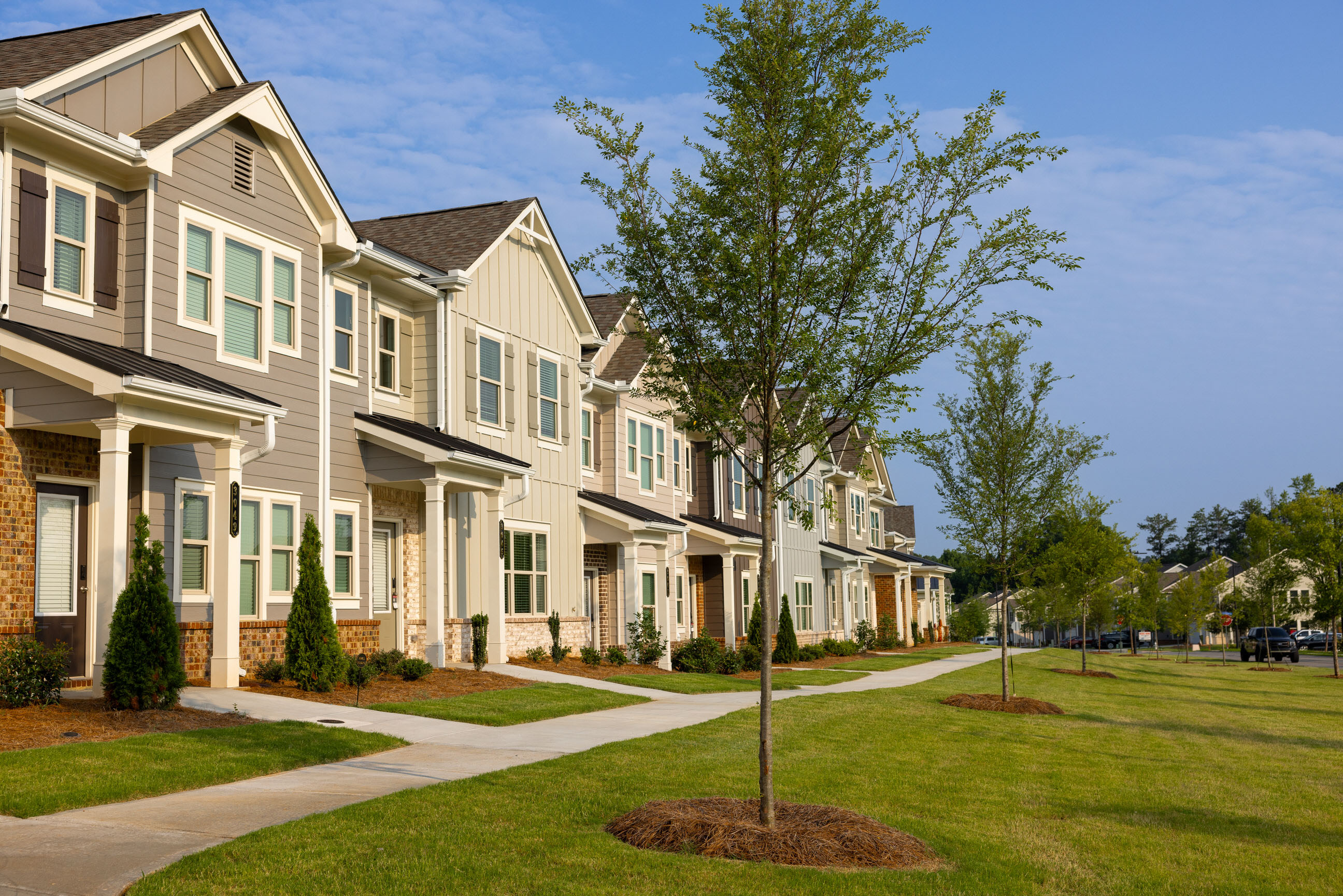 A row of modern, single-family town homes
